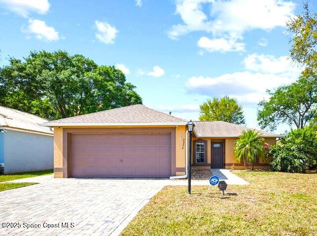 2977 Sebastian Lane Melbourne, FL 32935 - Photo 1 of 26 a house with swimming pool in front of it