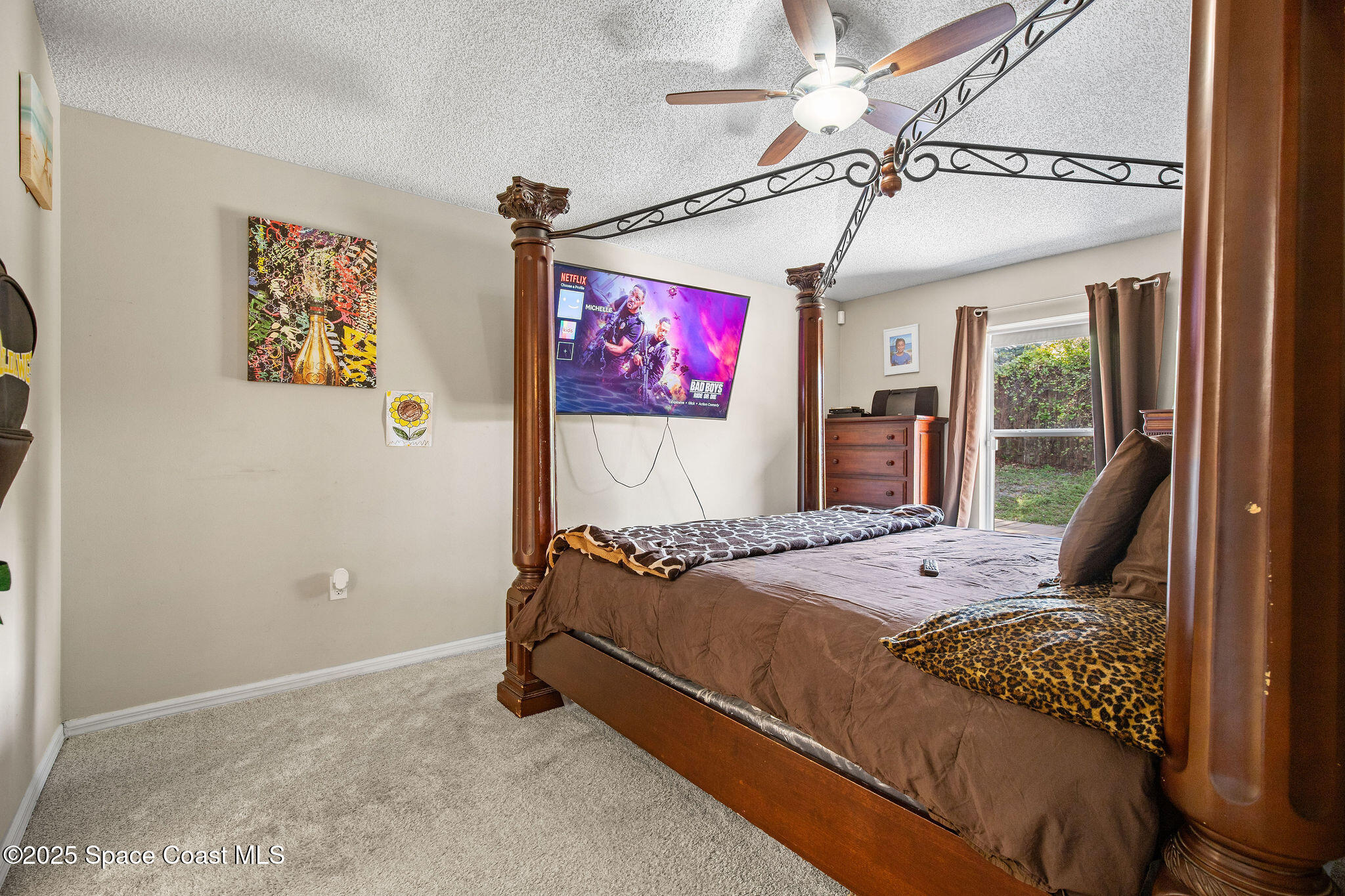 2977 Sebastian Lane Melbourne, FL 32935 - Photo 13 of 26 a bed sitting in a bedroom next to a window