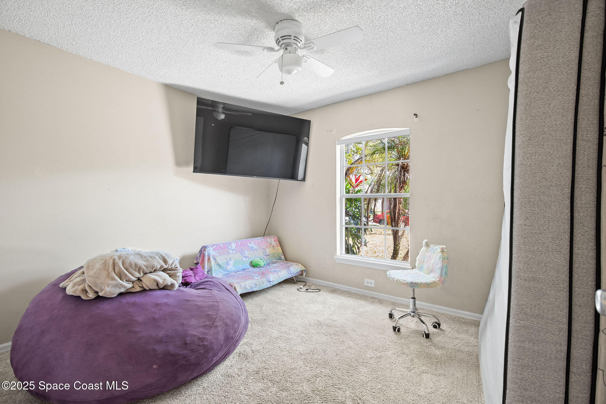 2977 Sebastian Lane Melbourne, FL 32935 - Photo 18 of 26 a living room with furniture and a window