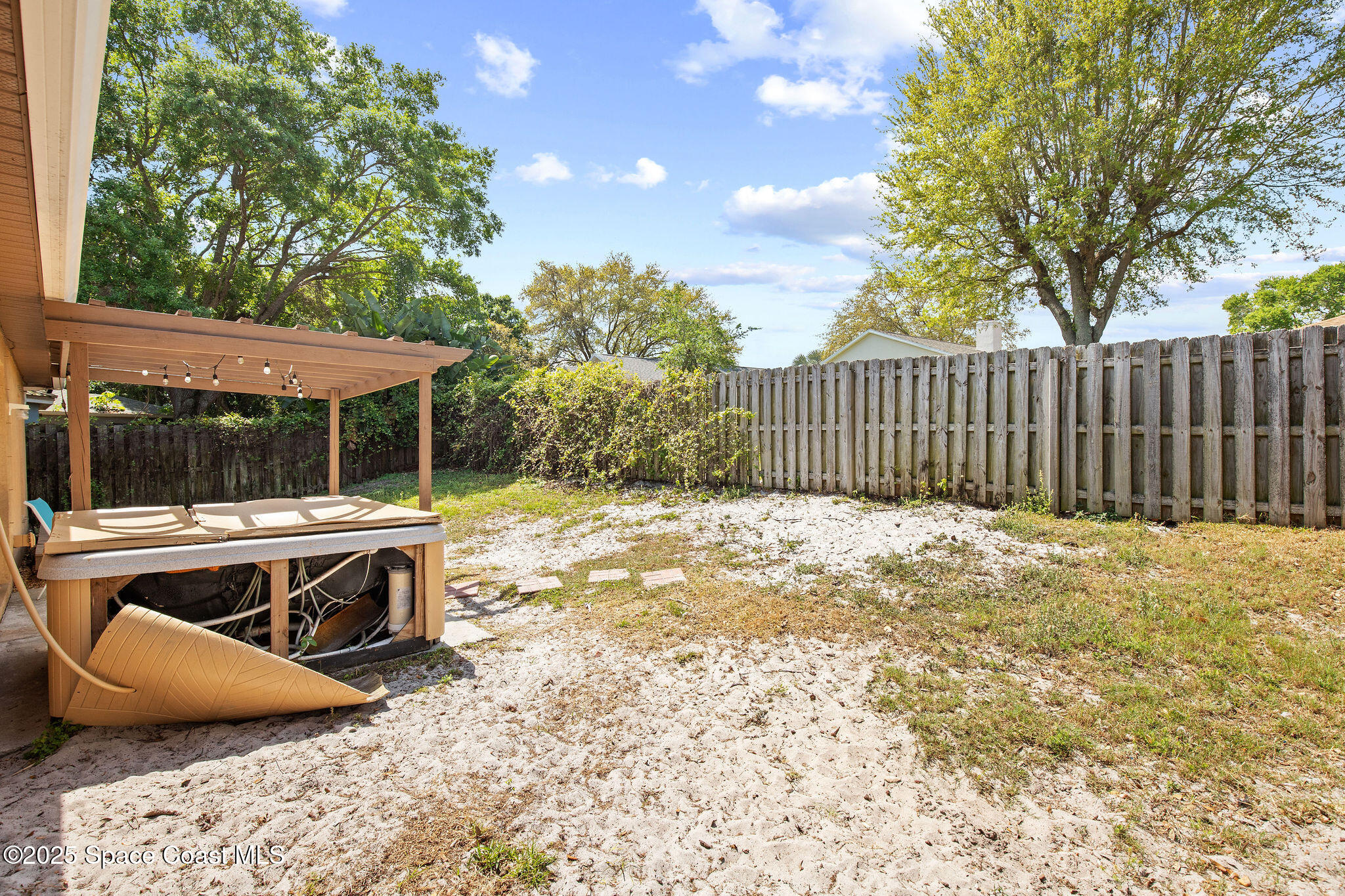 2977 Sebastian Lane Melbourne, FL 32935 - Photo 25 of 26 a view of backyard with deck and outdoor seating