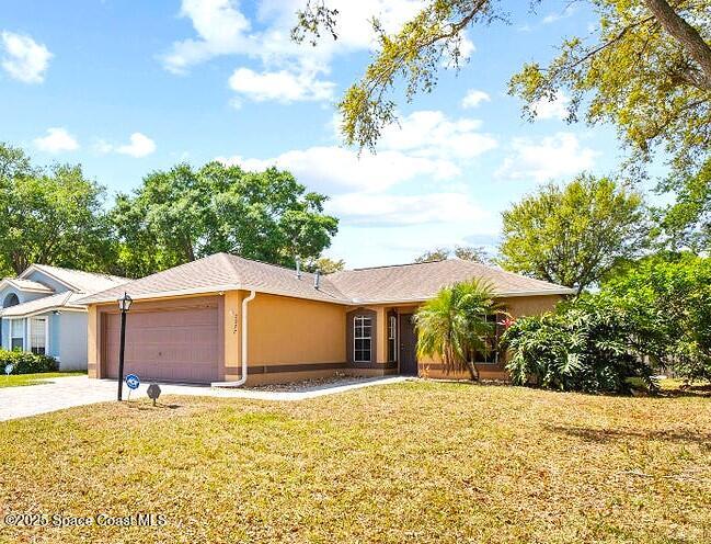 2977 Sebastian Lane Melbourne, FL 32935 - Photo 3 of 26 a view of a house with a yard