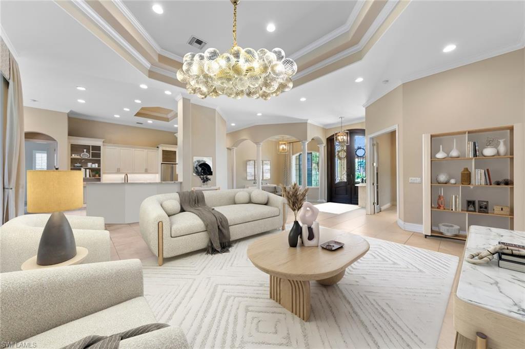 20008 Oak Fairways Court Estero, FL 33928 - Photo 11 of 49 a living room with furniture and a chandelier