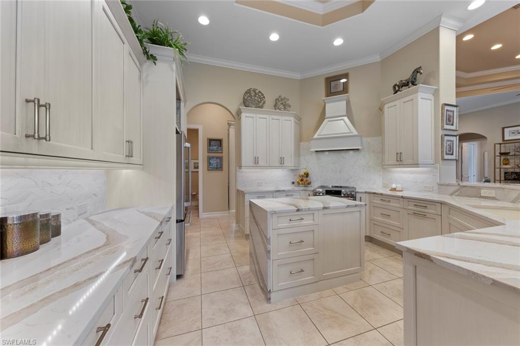 20008 Oak Fairways Court Estero, FL 33928 - Photo 12 of 49 a kitchen with a sink stove and cabinets