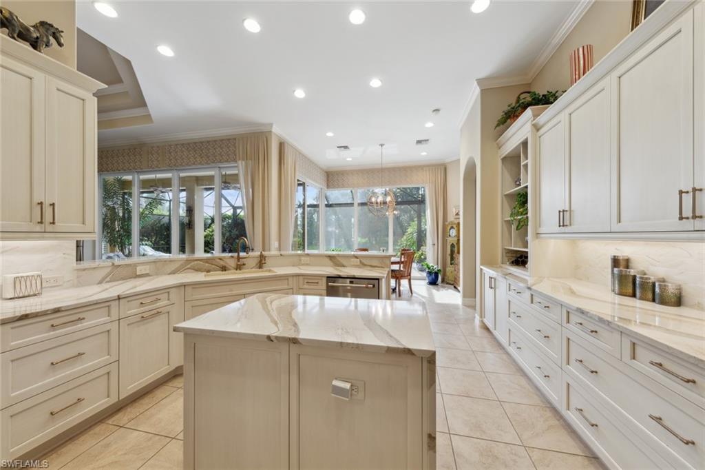 20008 Oak Fairways Court Estero, FL 33928 - Photo 14 of 49 a large white kitchen with granite countertop a large window