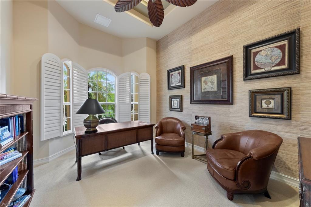 20008 Oak Fairways Court Estero, FL 33928 - Photo 20 of 49 a living room with furniture and a fireplace