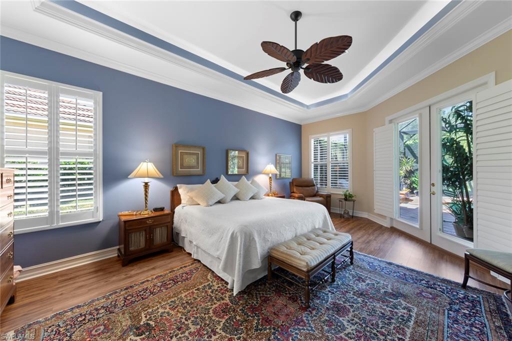 20008 Oak Fairways Court Estero, FL 33928 - Photo 22 of 49 a spacious bedroom with a large bed and a window