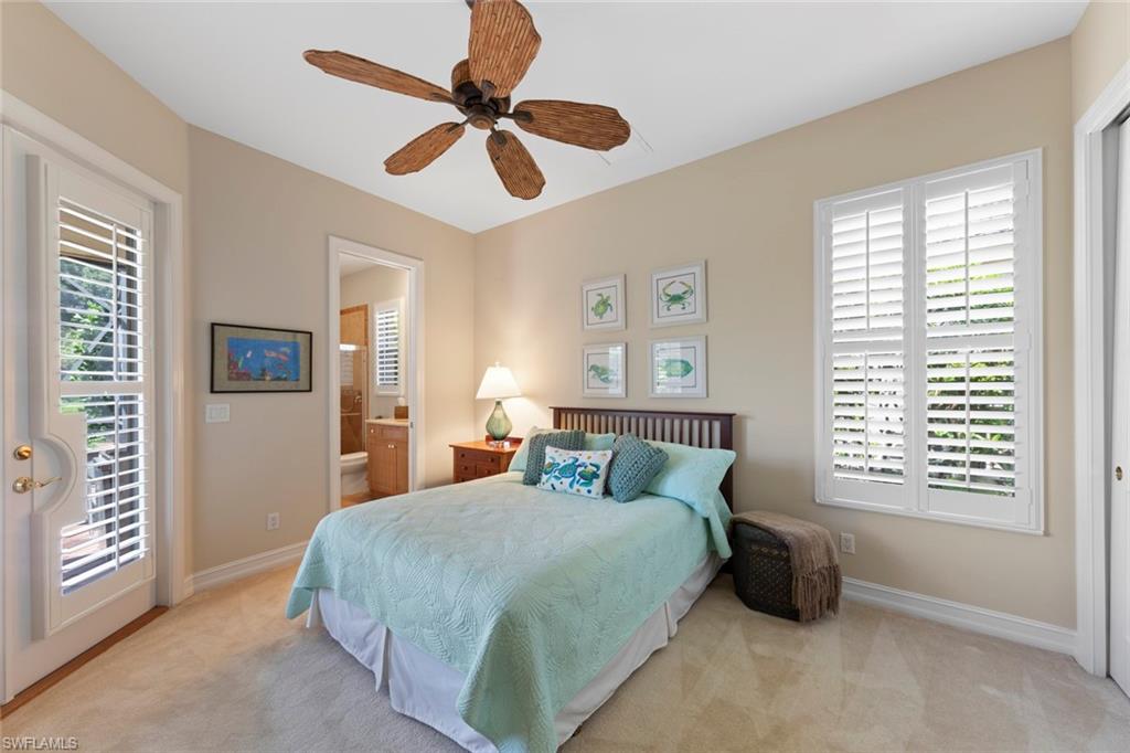 20008 Oak Fairways Court Estero, FL 33928 - Photo 26 of 49 a bedroom with a large bed and a window