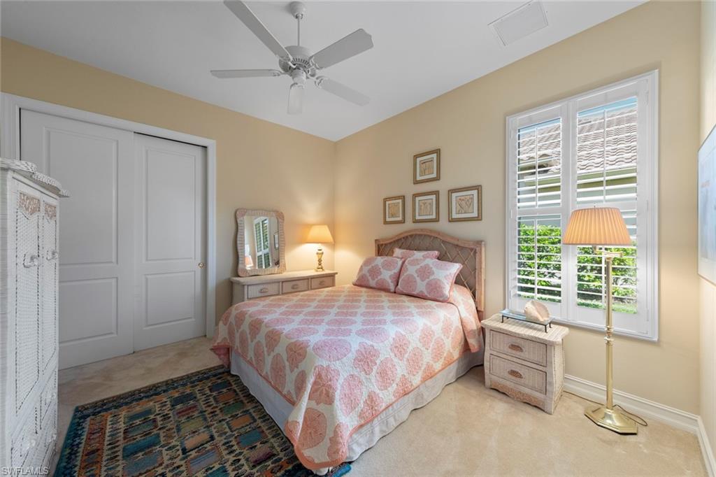 20008 Oak Fairways Court Estero, FL 33928 - Photo 28 of 49 a bedroom with a bed and a window
