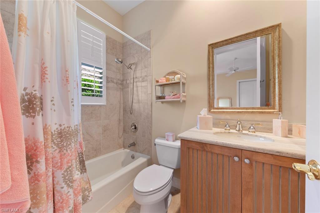 20008 Oak Fairways Court Estero, FL 33928 - Photo 29 of 49 a bathroom with a sink a toilet and shower curtain