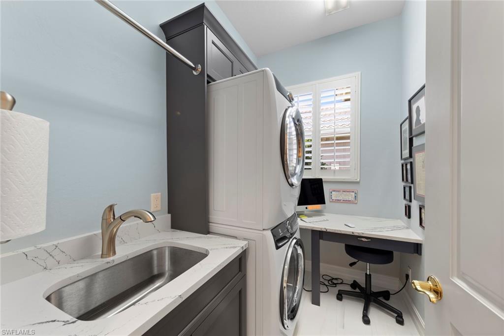 20008 Oak Fairways Court Estero, FL 33928 - Photo 30 of 49 a bathroom with a sink a toilet and a mirror