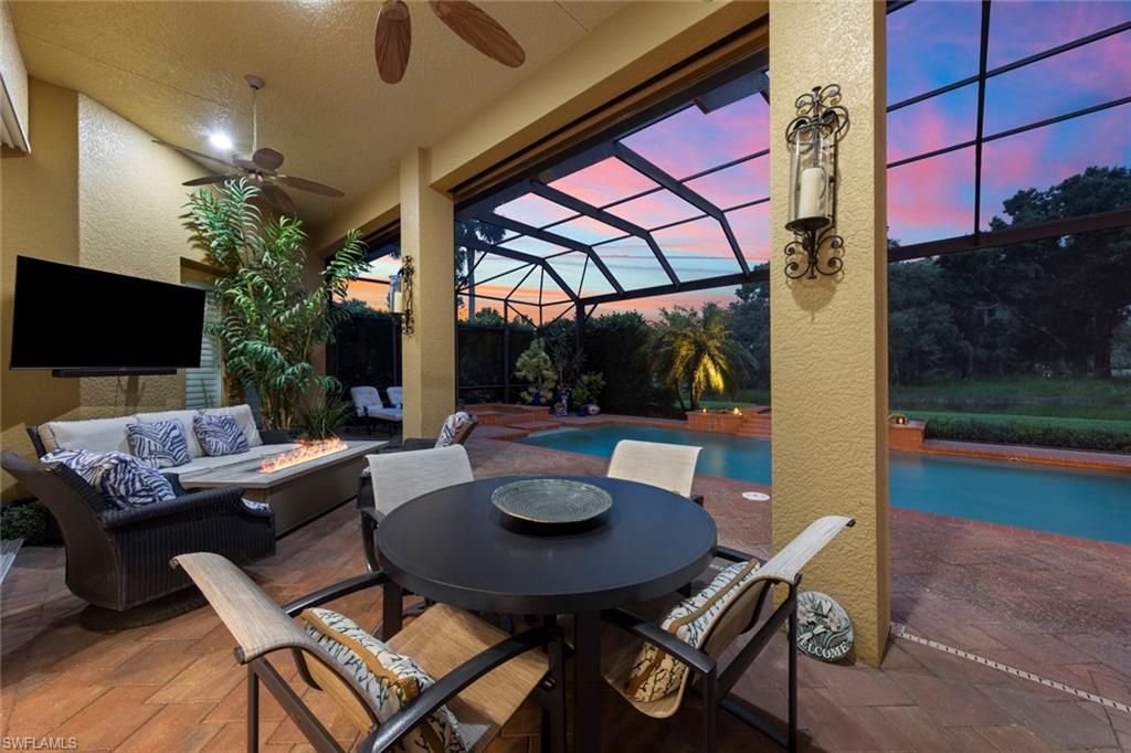 20008 Oak Fairways Court Estero, FL 33928 - Photo 32 of 49 a outdoor dining space with furniture and a potted plant