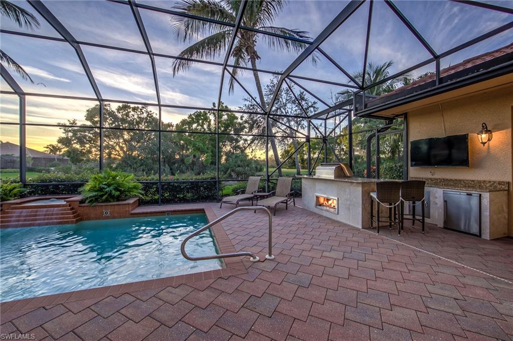 20008 Oak Fairways Court Estero, FL 33928 - Photo 37 of 49 a view of a swimming pool with a patio and a yard
