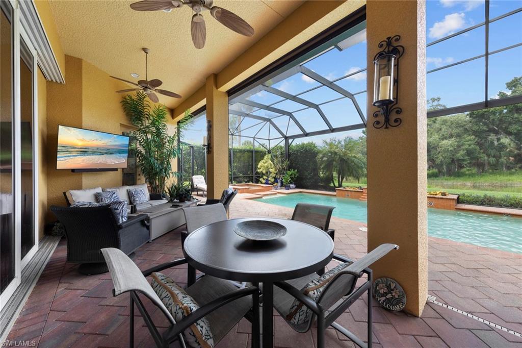 20008 Oak Fairways Court Estero, FL 33928 - Photo 39 of 49 a view of a patio with a table and chairs