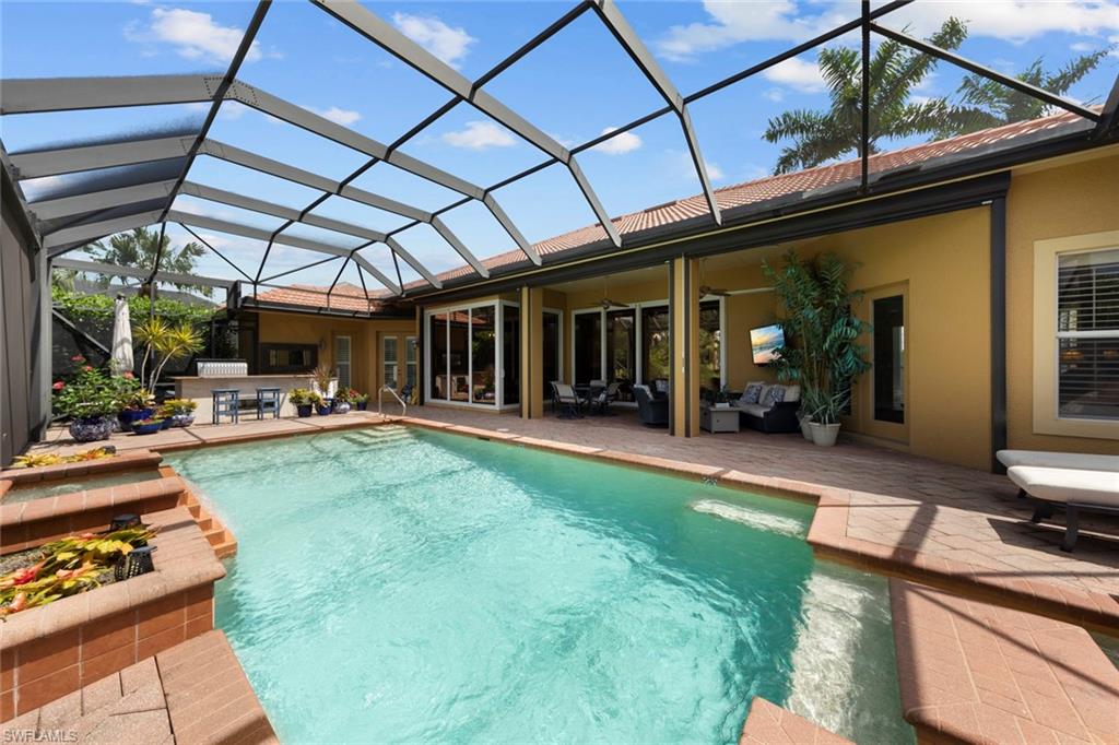 20008 Oak Fairways Court Estero, FL 33928 - Photo 40 of 49 a view of a backyard with dining space and furniture