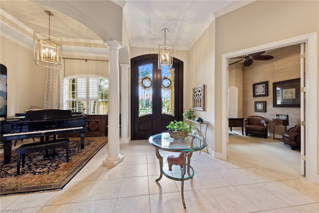 20008 Oak Fairways Court Estero, FL 33928 - Photo 4 of 49 a living room with furniture and a potted plant