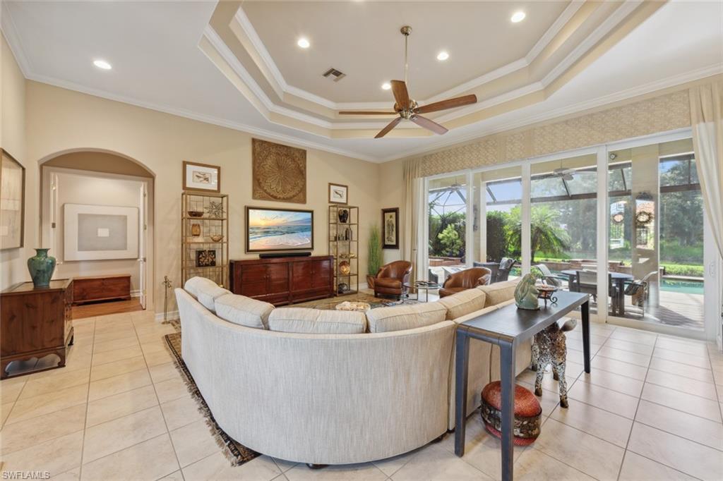 20008 Oak Fairways Court Estero, FL 33928 - Photo 7 of 49 a living room with couches and kitchen view with wooden floor