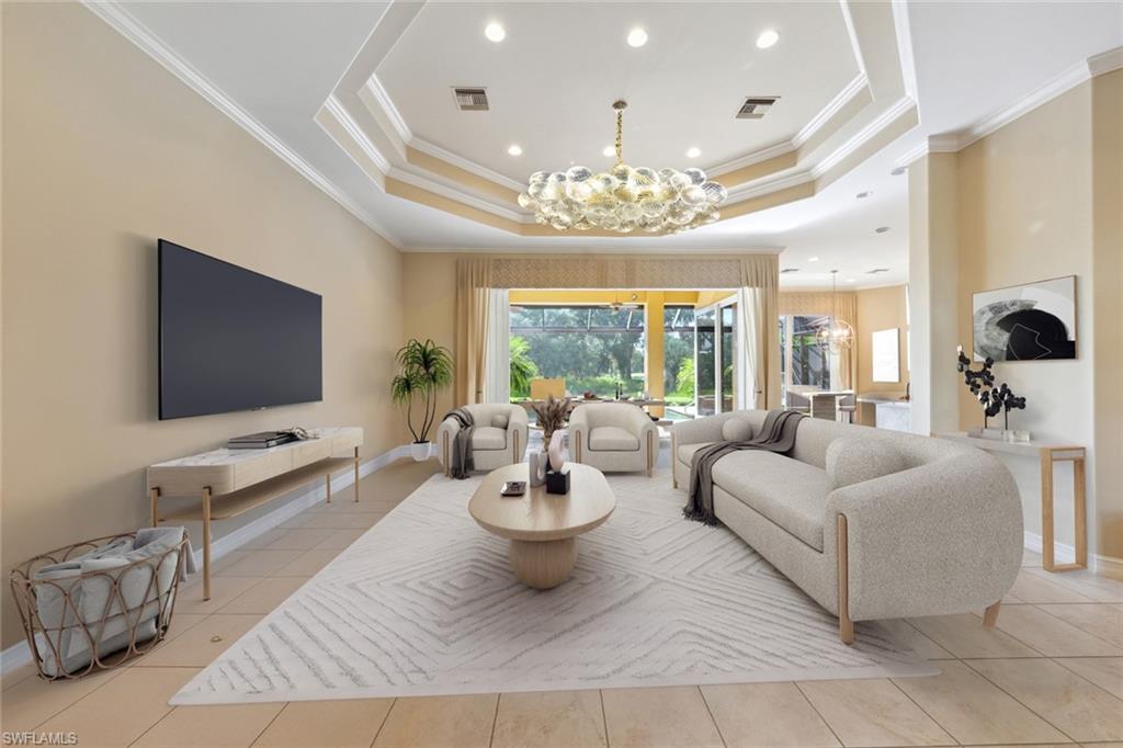 20008 Oak Fairways Court Estero, FL 33928 - Photo 8 of 49 a living room with furniture and a flat screen tv