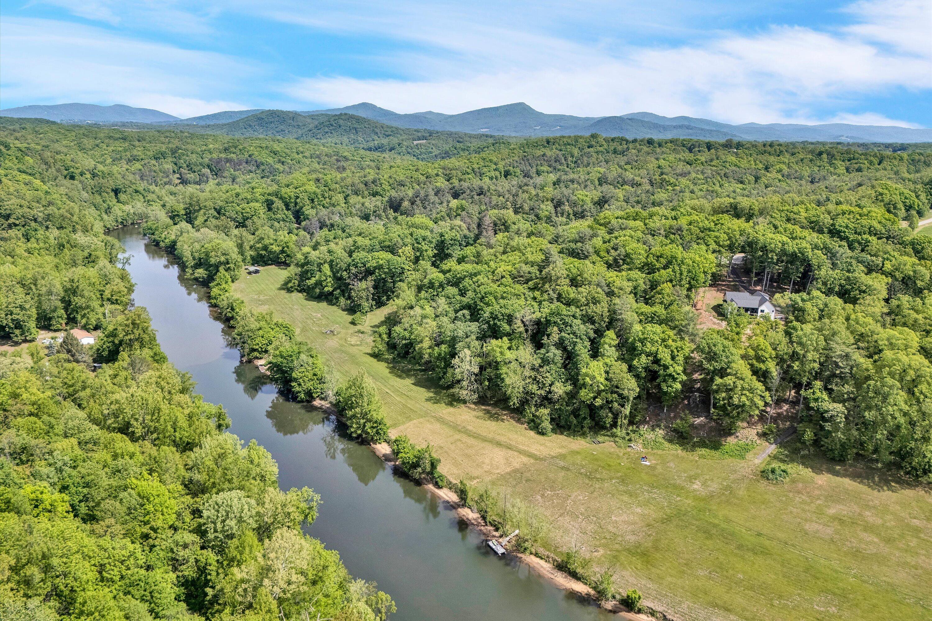 Lot 27 River Rock Road Vinton, VA 24179 - Photo 16 of 28 a view of a lush green hillside and houses