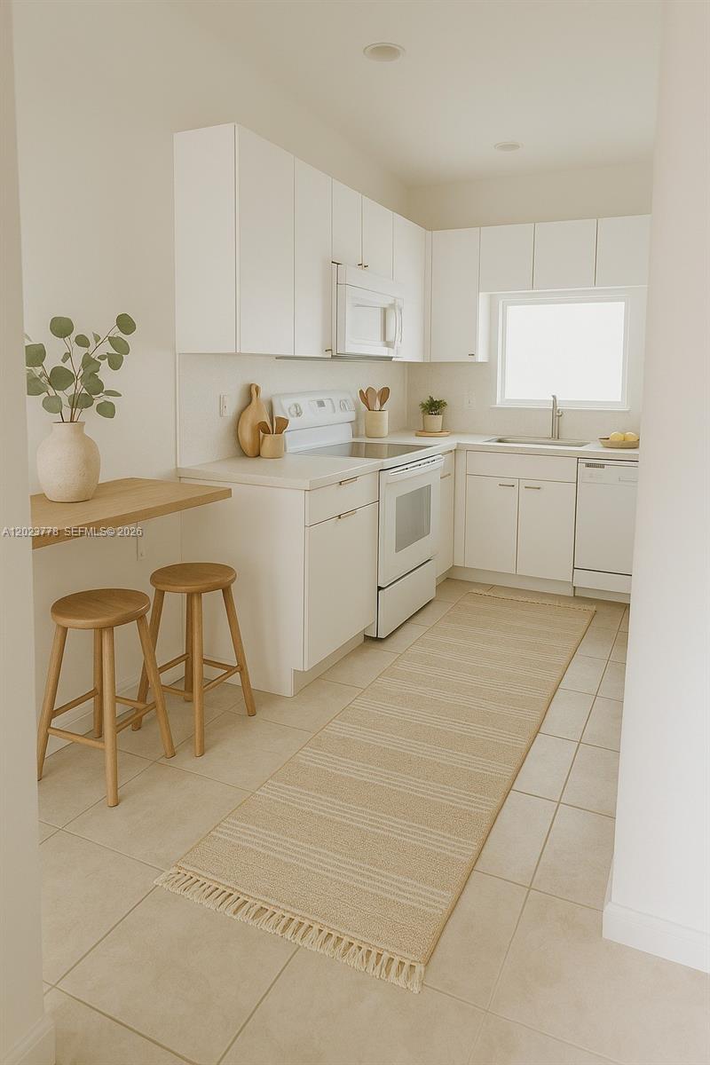 10245 Vía Hibiscus, Unit 10245 Boca Raton, FL 33428 - Photo 3 of 28 a kitchen with cabinets and white appliances