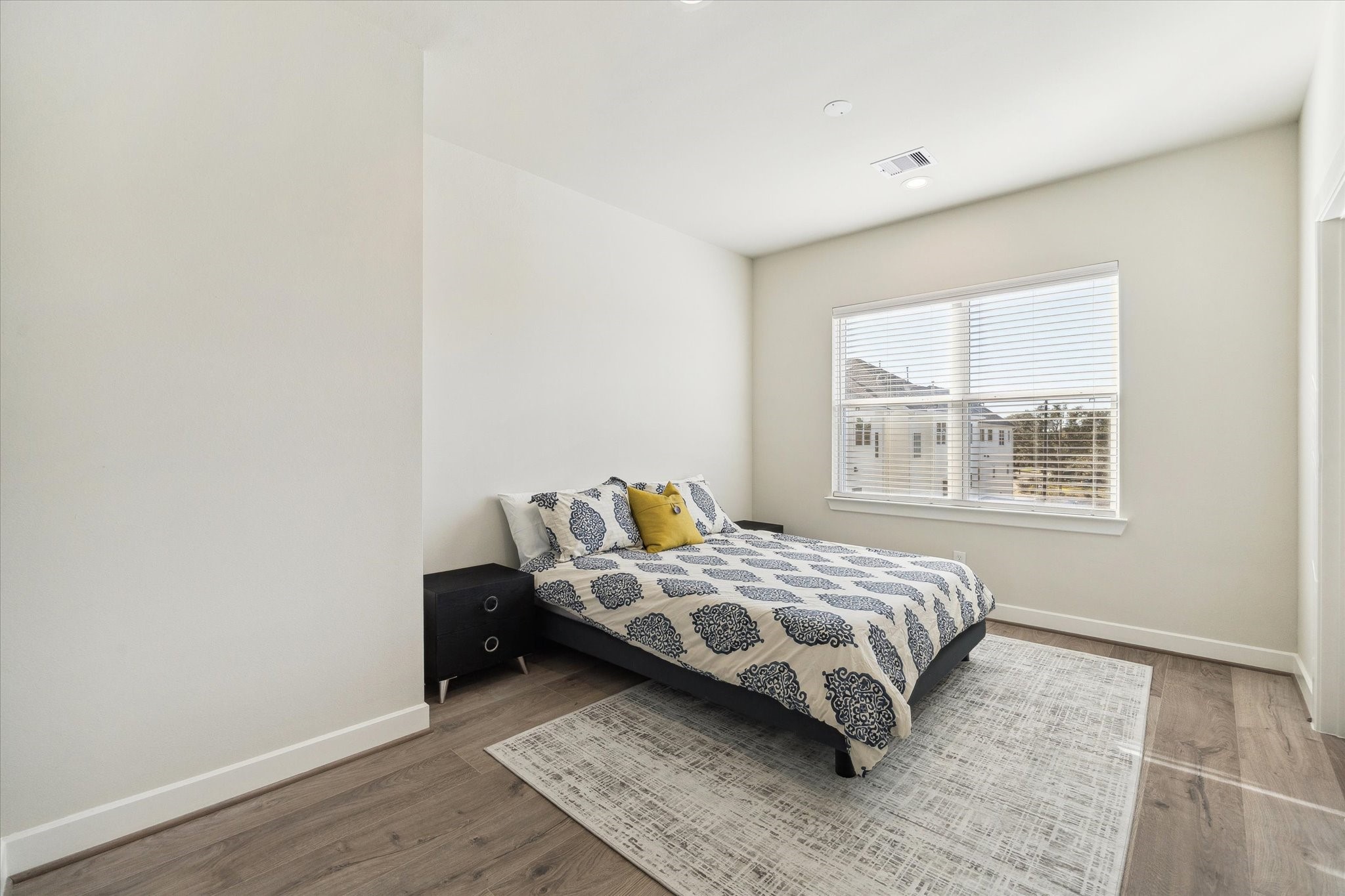 10616 Cascade Ledge Lane Houston, TX 77025 - Photo 14 of 20 Large windows bring in natural light, creating a comfortable and inviting bedroom space.