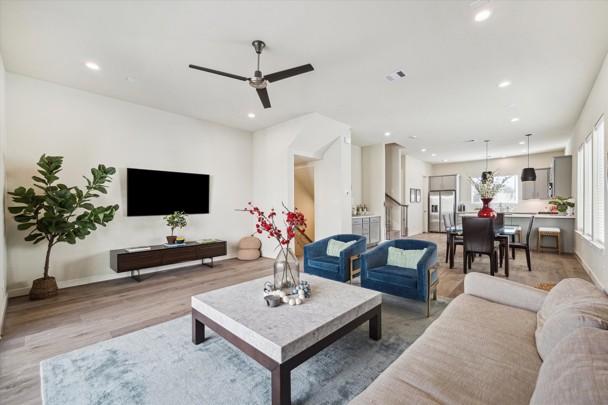 10616 Cascade Ledge Lane Houston, TX 77025 - Photo 6 of 20 Large windows and sliding doors connect the living space to outdoor views while maintaining a bright, airy feel.