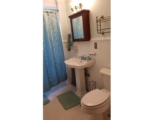 27 Mountainview Street Springfield, MA 01108 - Photo 14 of 20 a bathroom with a toilet sink and mirror