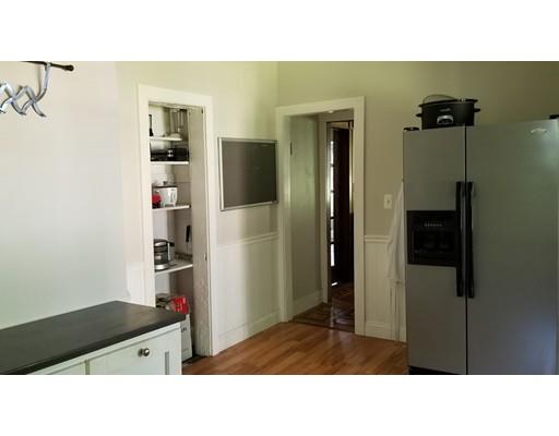 27 Mountainview Street Springfield, MA 01108 - Photo 3 of 20 a kitchen with a refrigerator and a sink