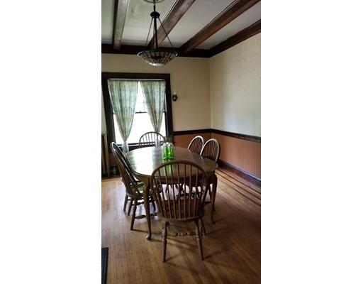 27 Mountainview Street Springfield, MA 01108 - Photo 8 of 20 a view of a dining room with furniture and a potted plant