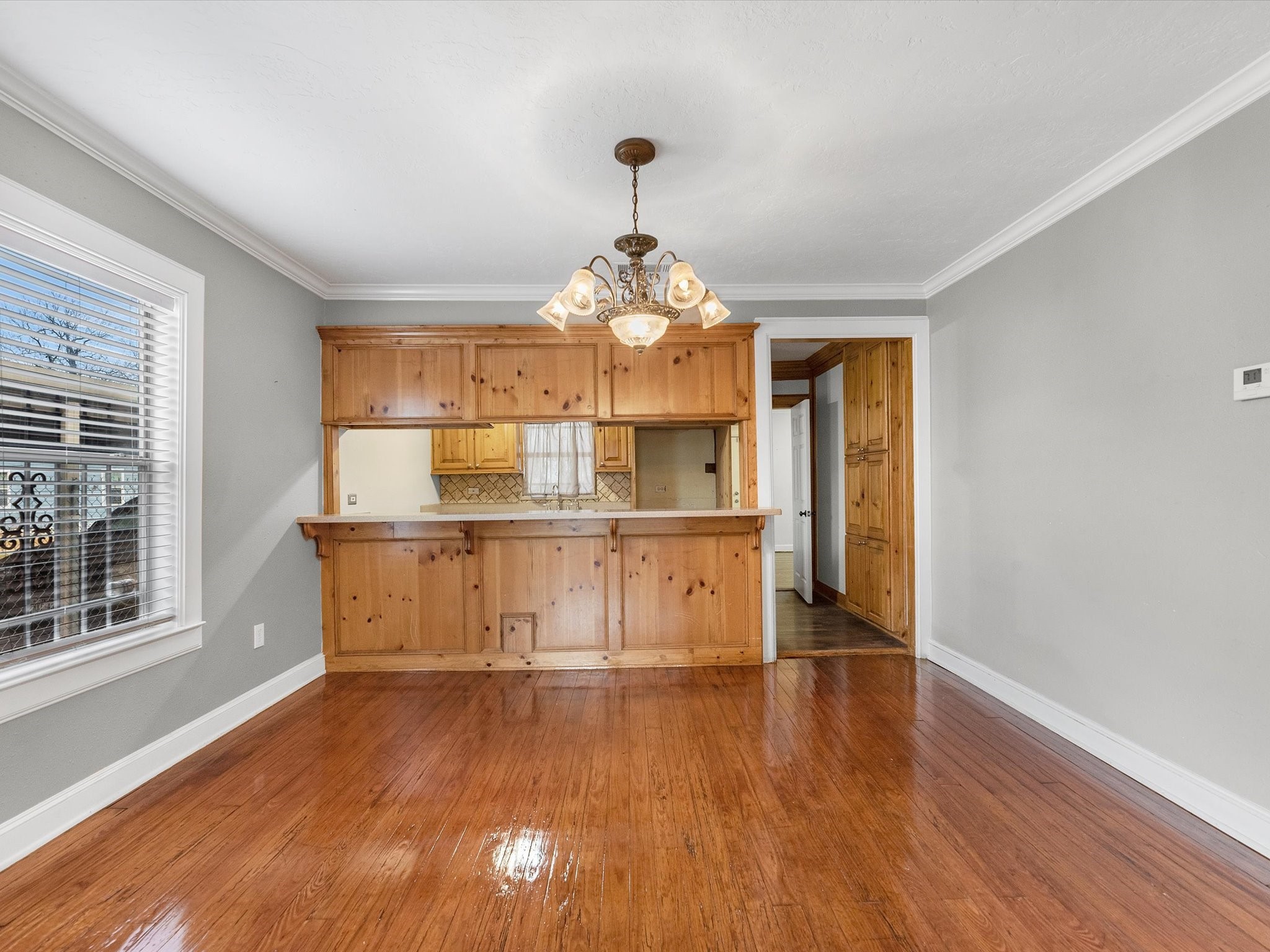1211 Bigelow Street Houston, TX 77009 - Photo 4 of 18 a room with wooden floors and window