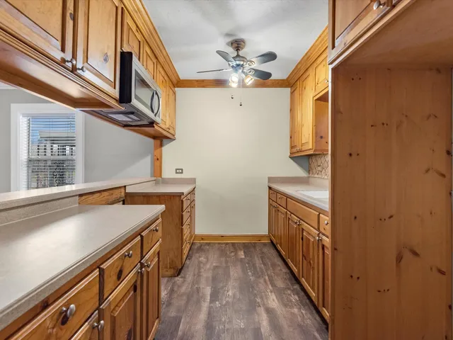 a view of a kitchen with a sink and dishwasher
