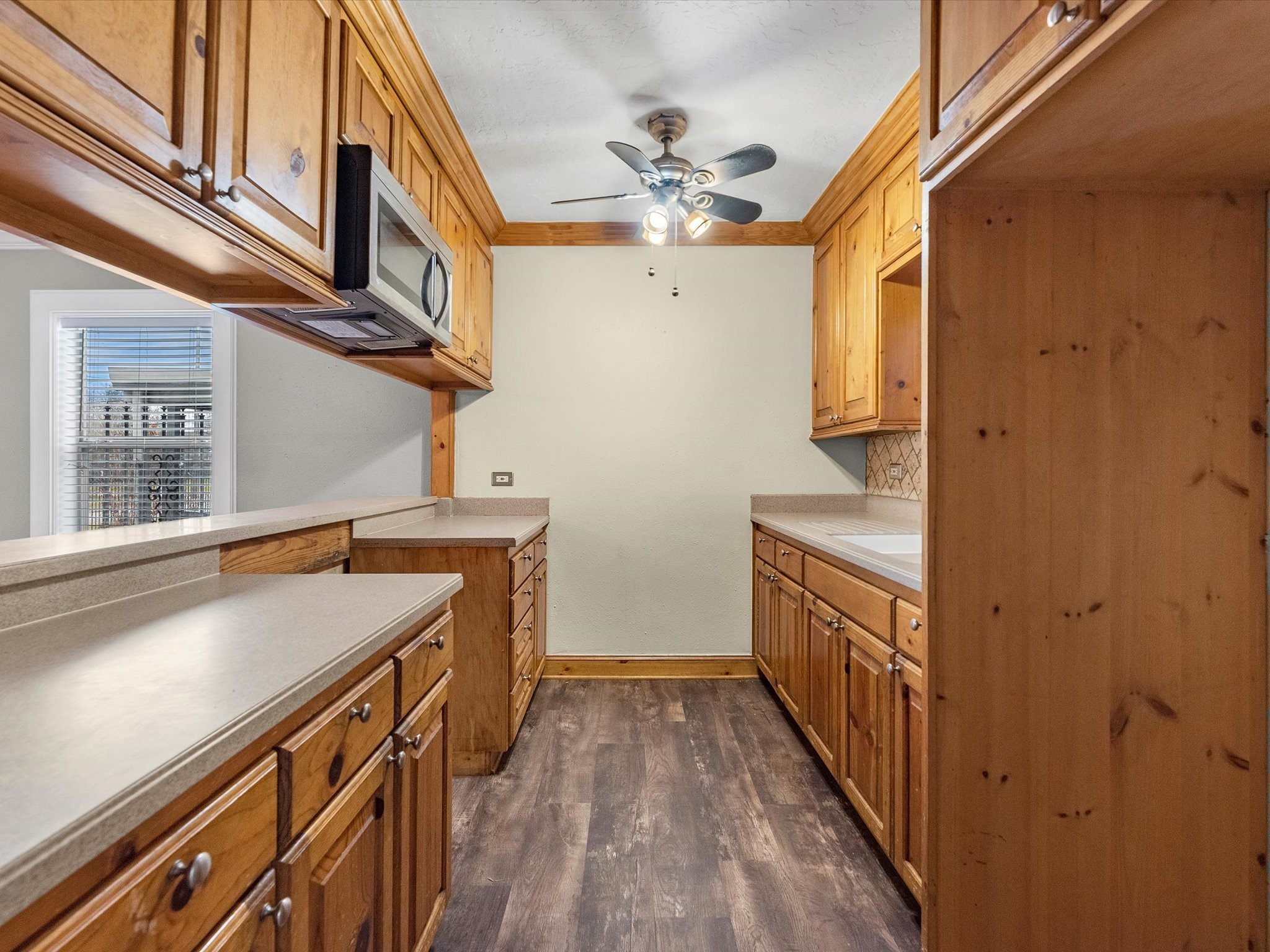 1211 Bigelow Street Houston, TX 77009 - Photo 6 of 18 a view of a kitchen with a sink and dishwasher