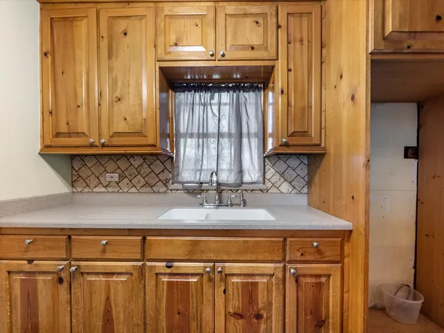 a view of a sink and a cabinet
