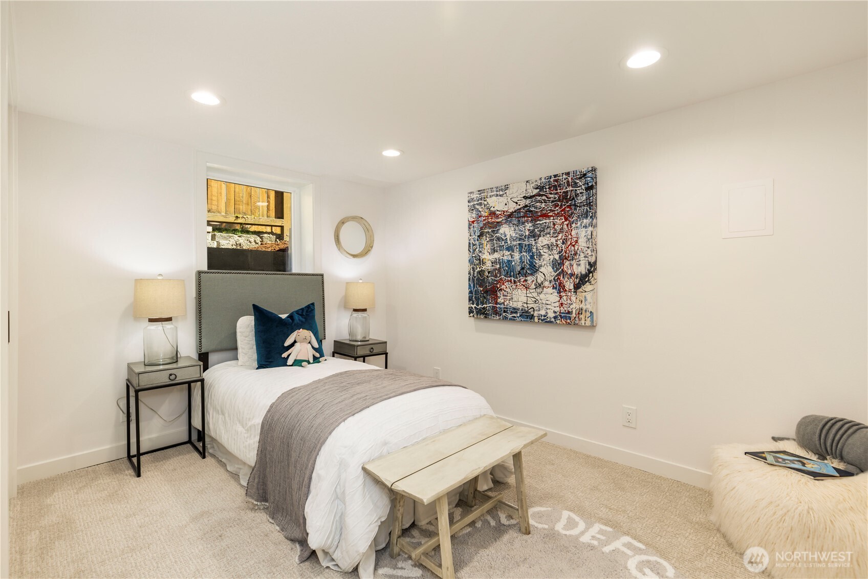 828 Northeast 95th Street Seattle, WA 98115 - Photo 15 of 18 a bedroom with a bed and a lamp