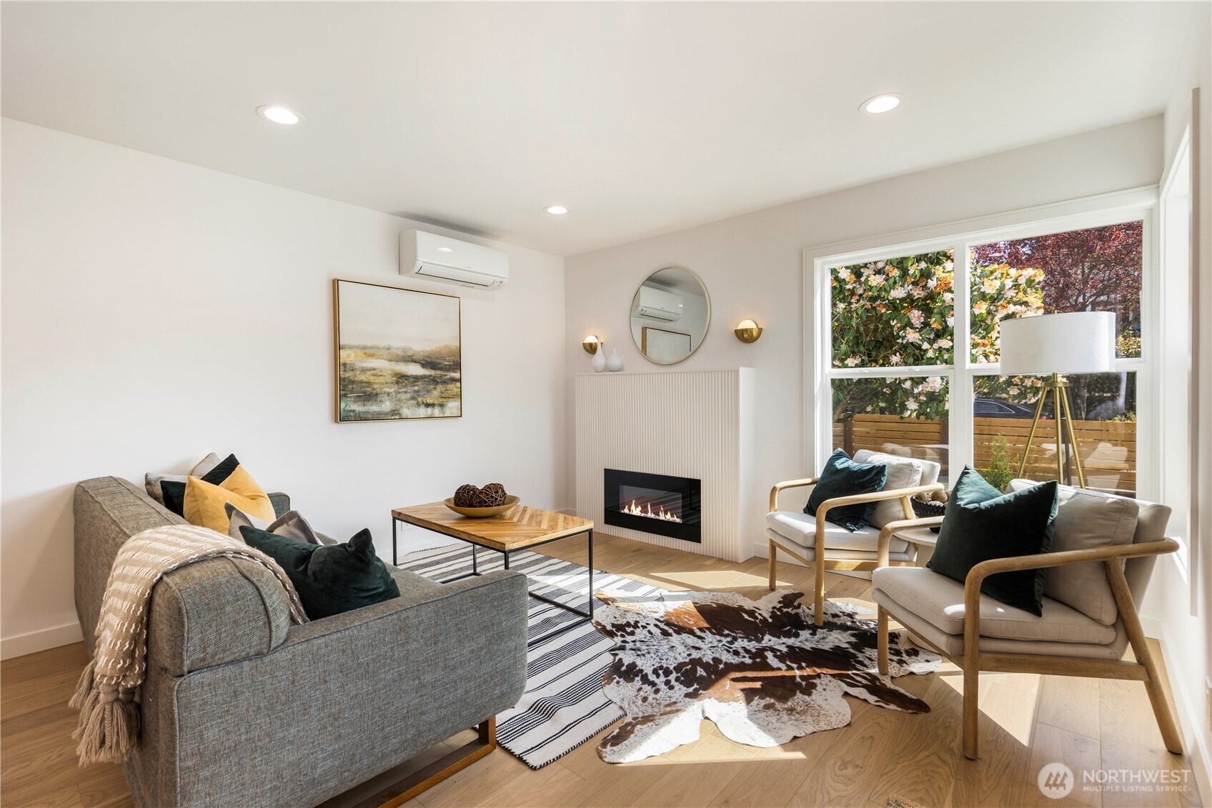 828 Northeast 95th Street Seattle, WA 98115 - Photo 2 of 18 a living room with furniture and a fireplace