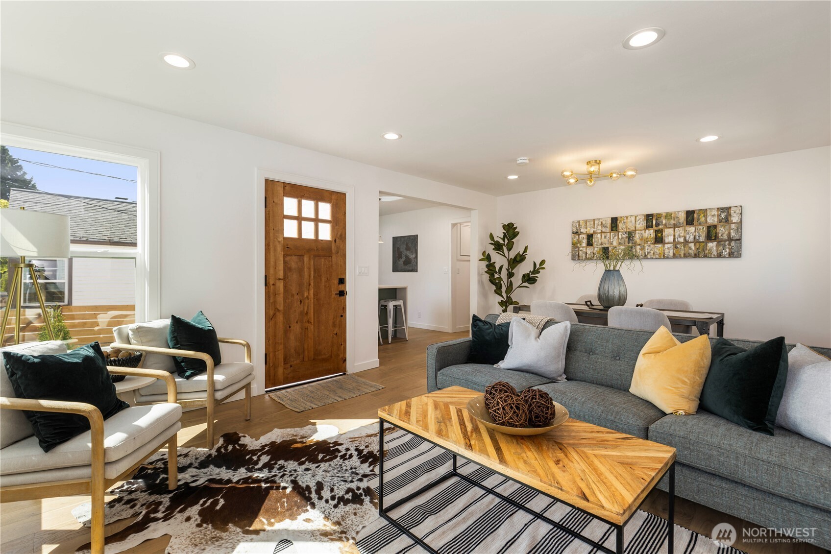 828 Northeast 95th Street Seattle, WA 98115 - Photo 3 of 18 a living room with furniture and wooden floor
