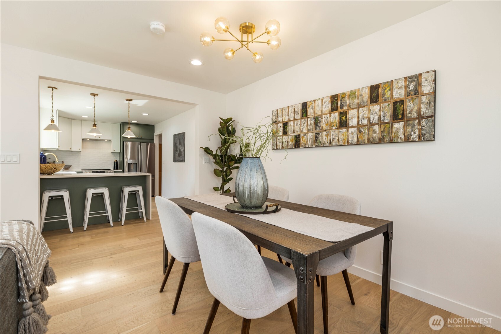 828 Northeast 95th Street Seattle, WA 98115 - Photo 4 of 18 a view of a dining room with furniture and wooden floor
