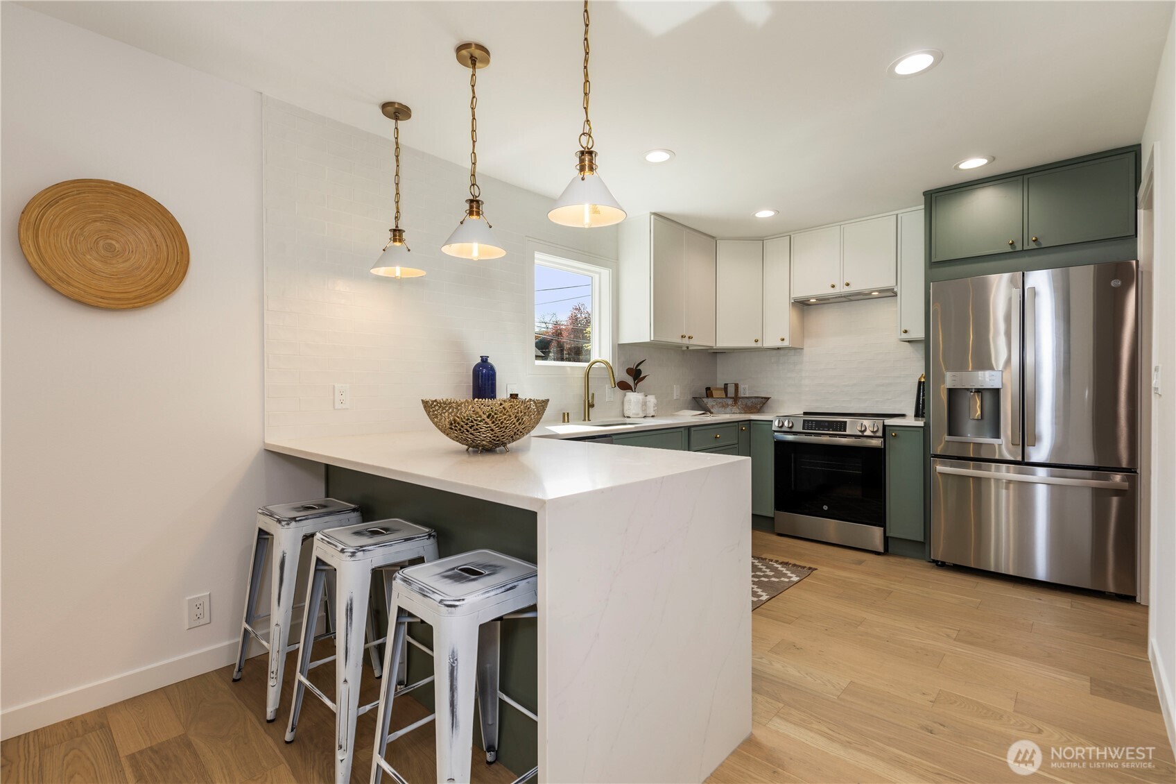 828 Northeast 95th Street Seattle, WA 98115 - Photo 5 of 18 a kitchen with a refrigerator a stove and a sink