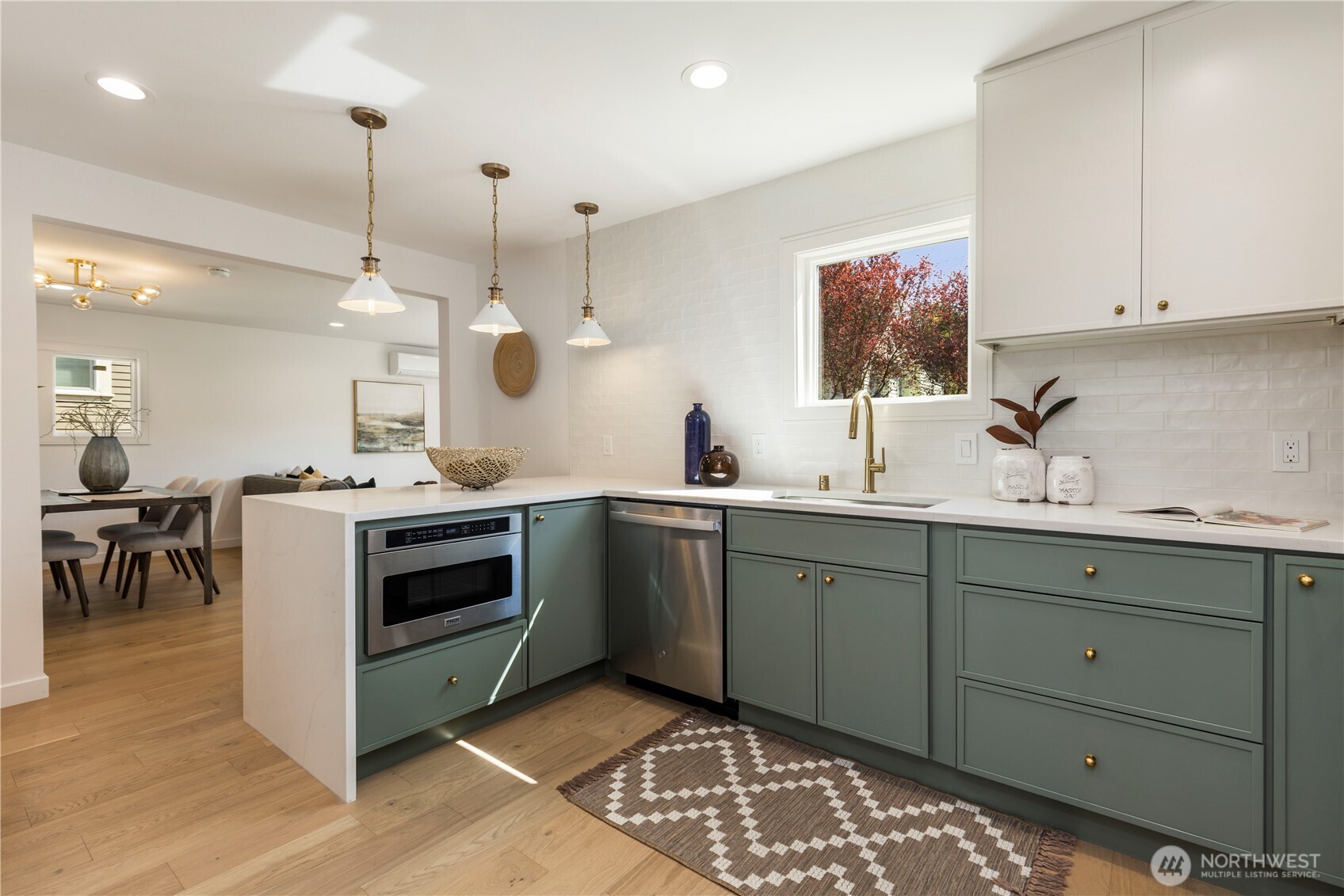 828 Northeast 95th Street Seattle, WA 98115 - Photo 6 of 18 a kitchen with a sink and stove