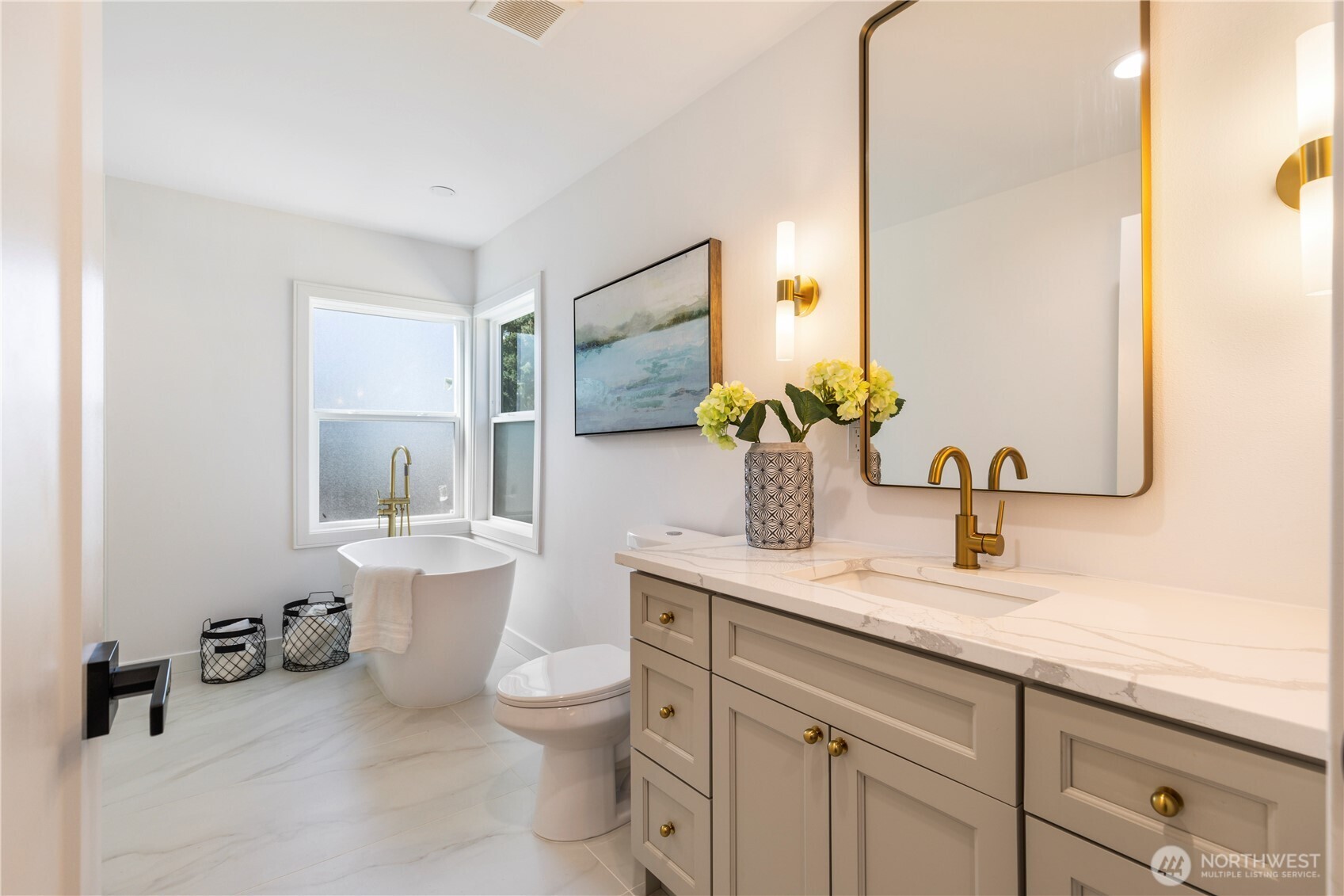 828 Northeast 95th Street Seattle, WA 98115 - Photo 10 of 18 a bathroom with a toilet sink and mirror