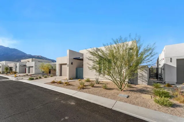 a view of a street with a building in the background