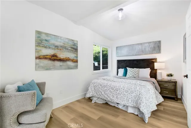 a bedroom with a bed and a couch