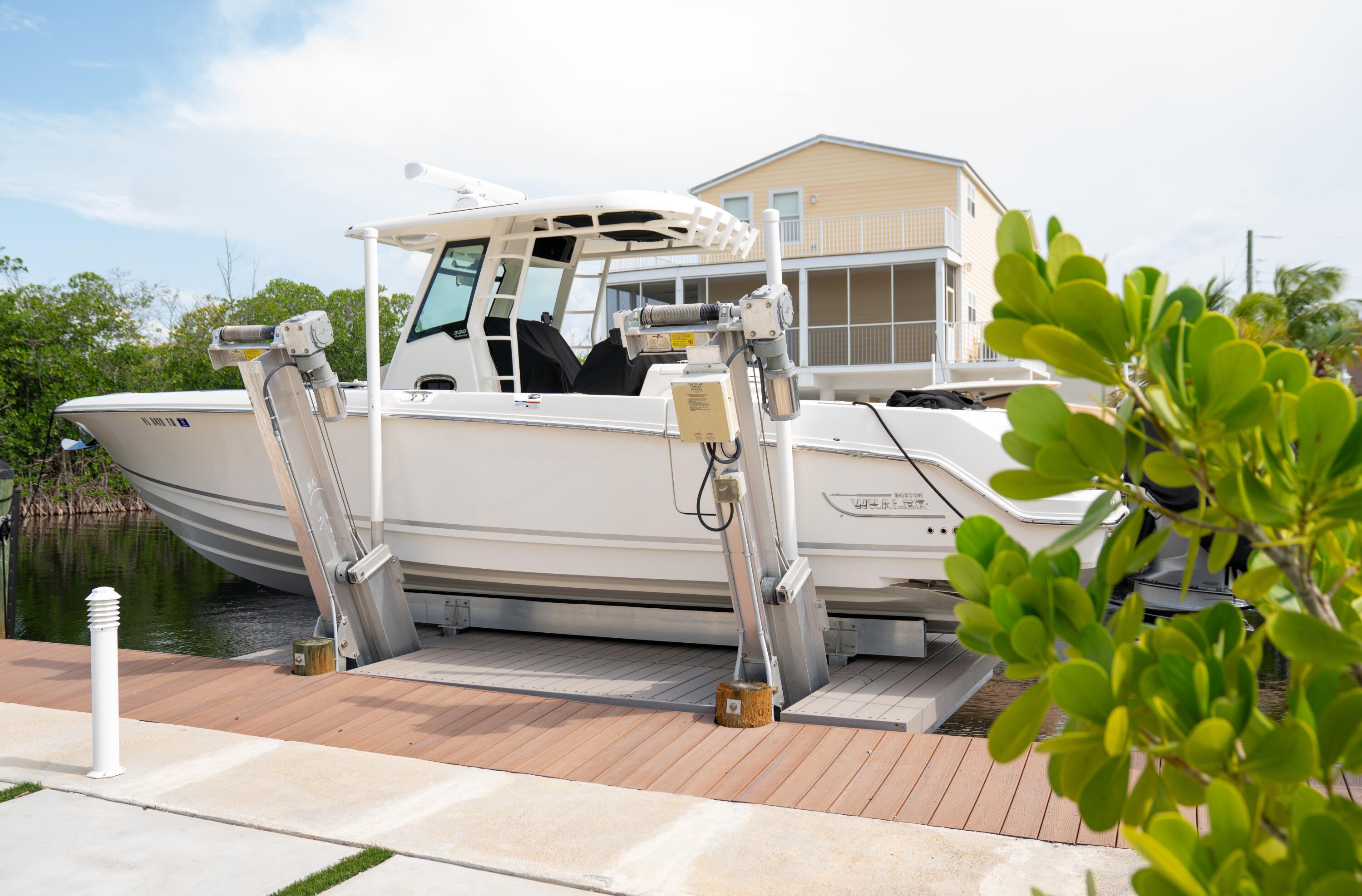 475 Bahia Honda Road Key Largo, FL 33037 - Photo 131 of 134 a view of a white house in front of a yard
