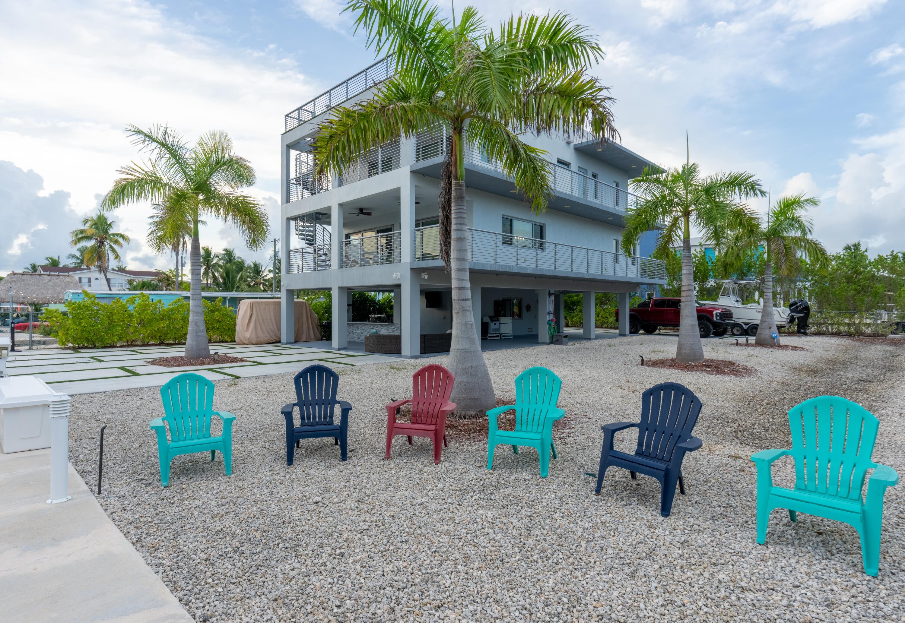475 Bahia Honda Road Key Largo, FL 33037 - Photo 26 of 134 a view of backyard with outdoor seating and barbeque oven