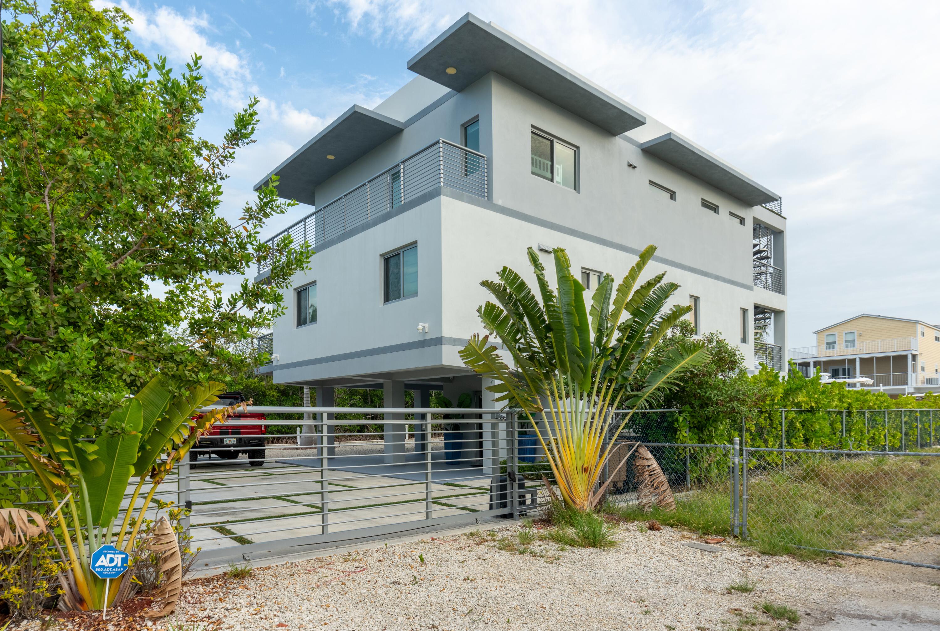 475 Bahia Honda Road Key Largo, FL 33037 - Photo 29 of 134 a front view of a house with garden