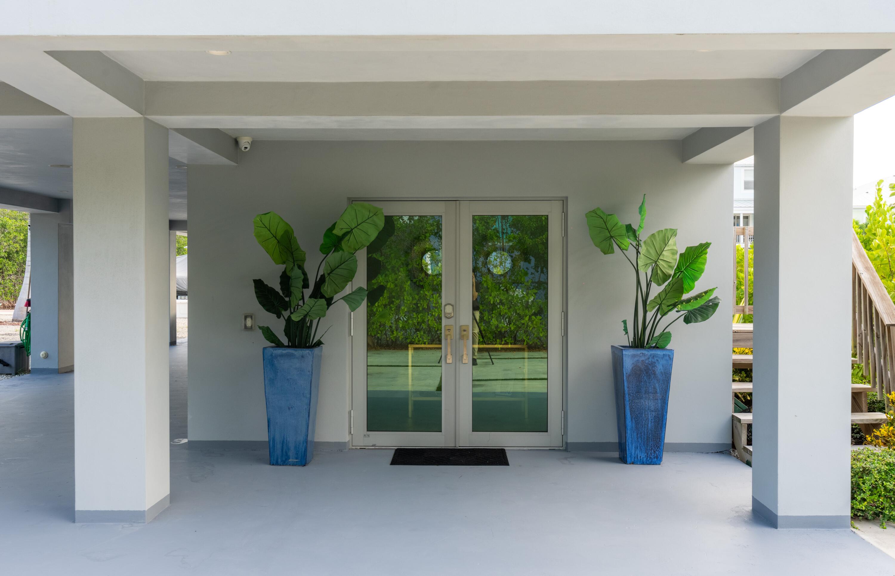 475 Bahia Honda Road Key Largo, FL 33037 - Photo 31 of 134 a potted plant sitting in front of a house