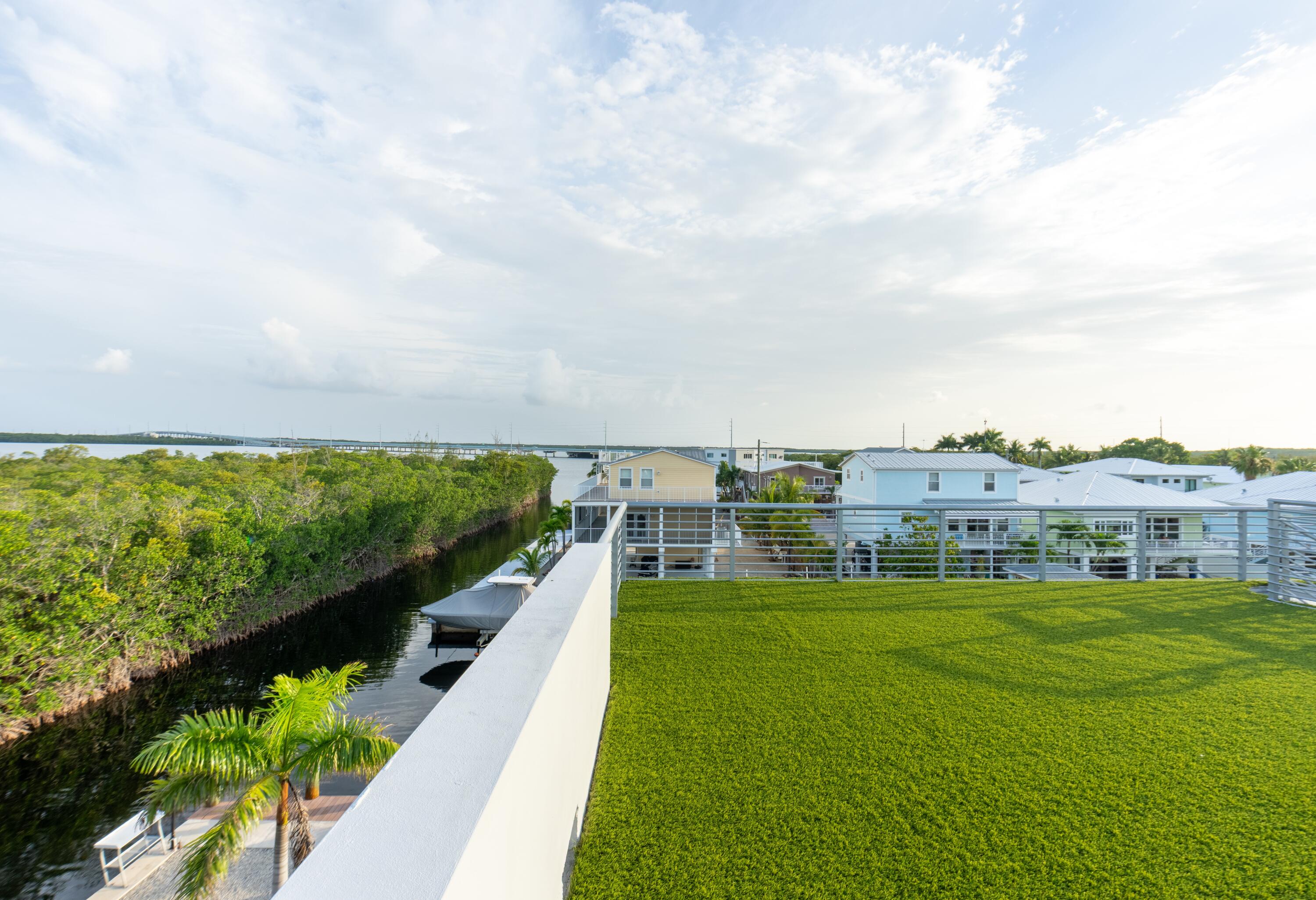 475 Bahia Honda Road Key Largo, FL 33037 - Photo 40 of 134 a view of a swimming pool with a garden
