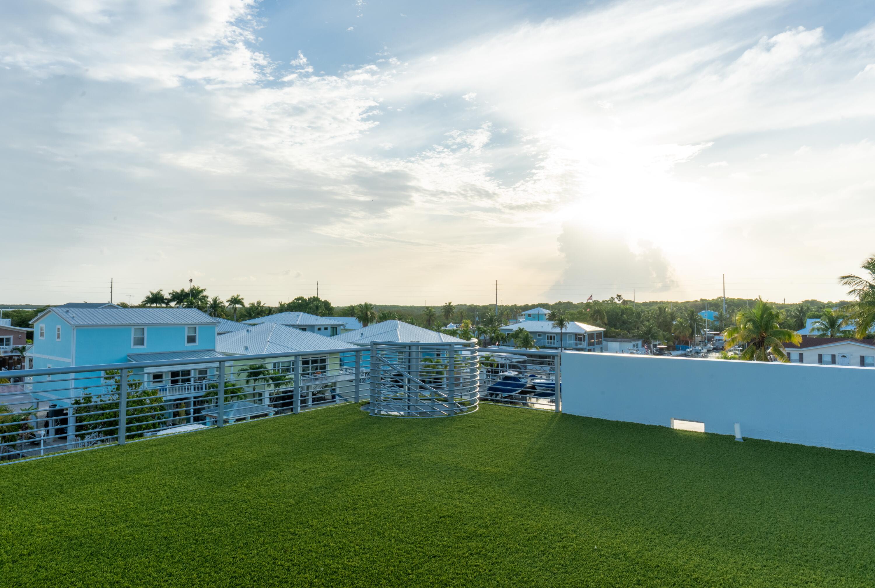 475 Bahia Honda Road Key Largo, FL 33037 - Photo 41 of 134 a view of a terrace with a garden