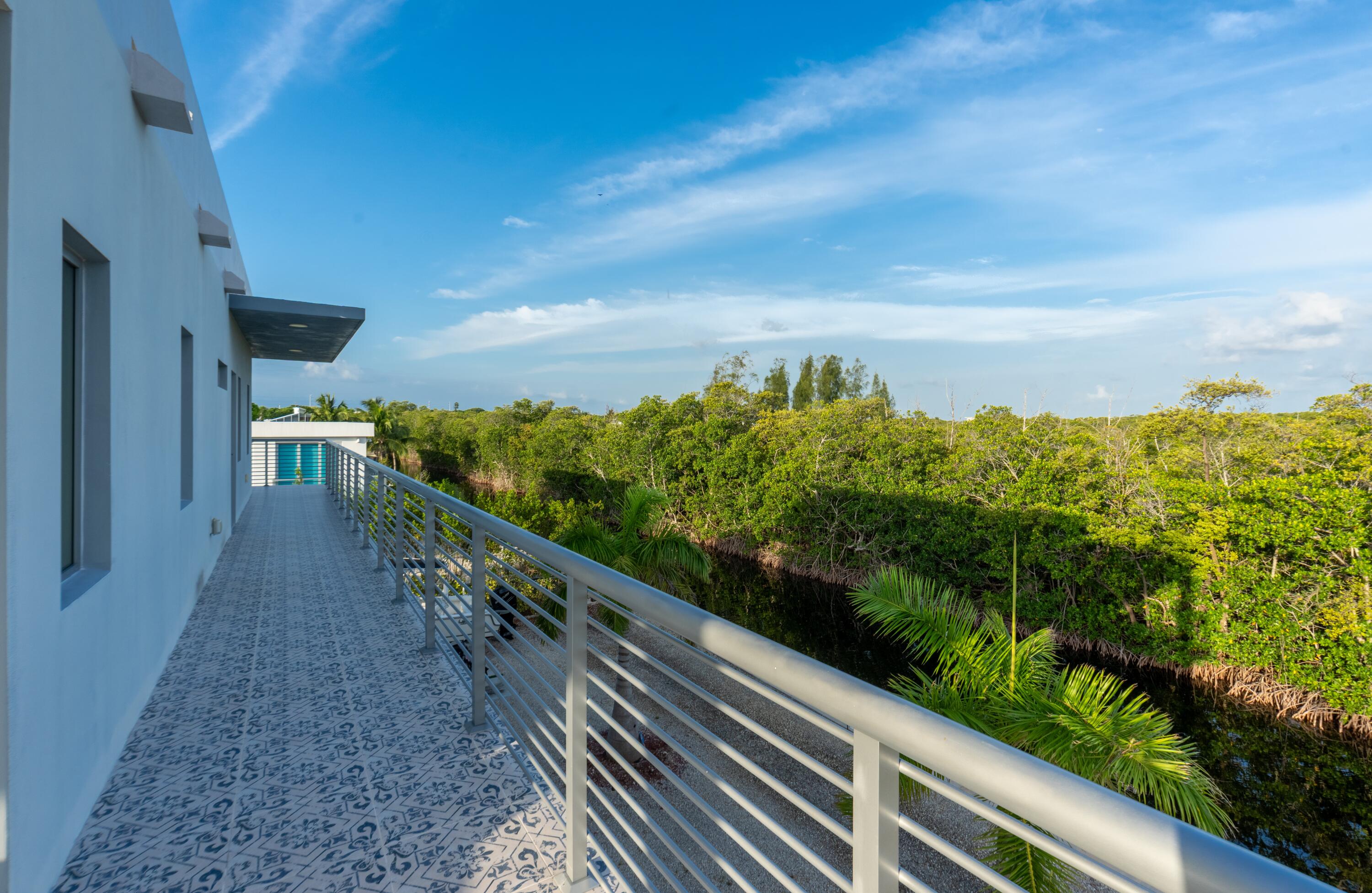 475 Bahia Honda Road Key Largo, FL 33037 - Photo 45 of 134 a view of a balcony with an outdoor seating