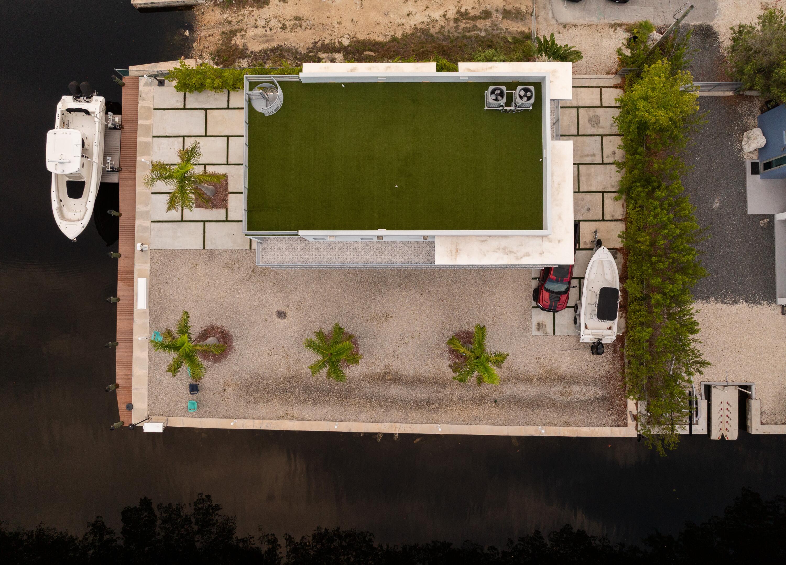 475 Bahia Honda Road Key Largo, FL 33037 - Photo 5 of 134 an aerial view of a house with a swimming pool
