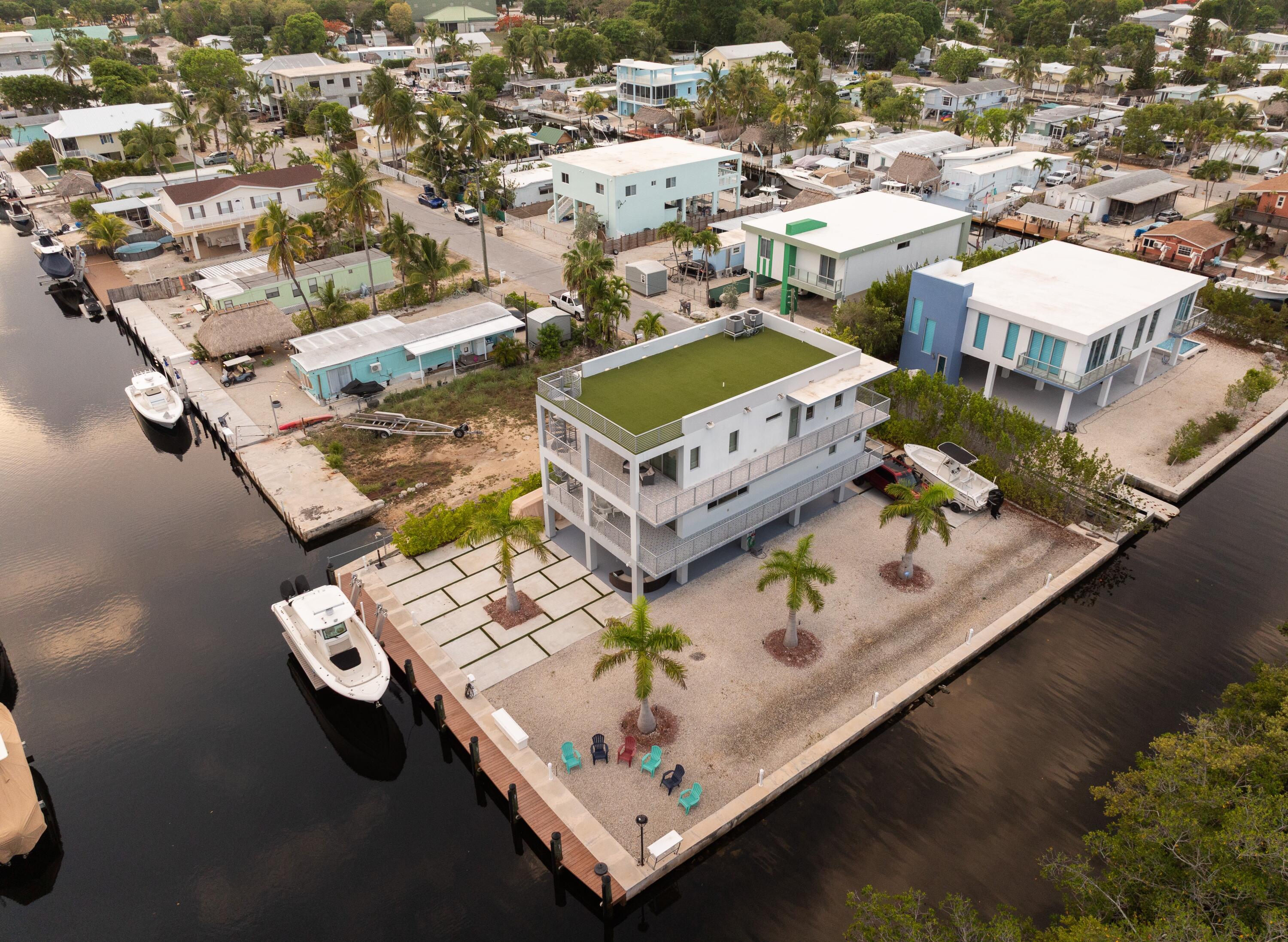 475 Bahia Honda Road Key Largo, FL 33037 - Photo 6 of 134 an aerial view of a residential apartment building with a swimming pool and outdoor seating